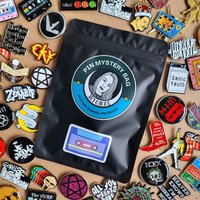 Music band enamel pin badge mystery bag featuring 1 music themed enamel pin badge, blind bag gift