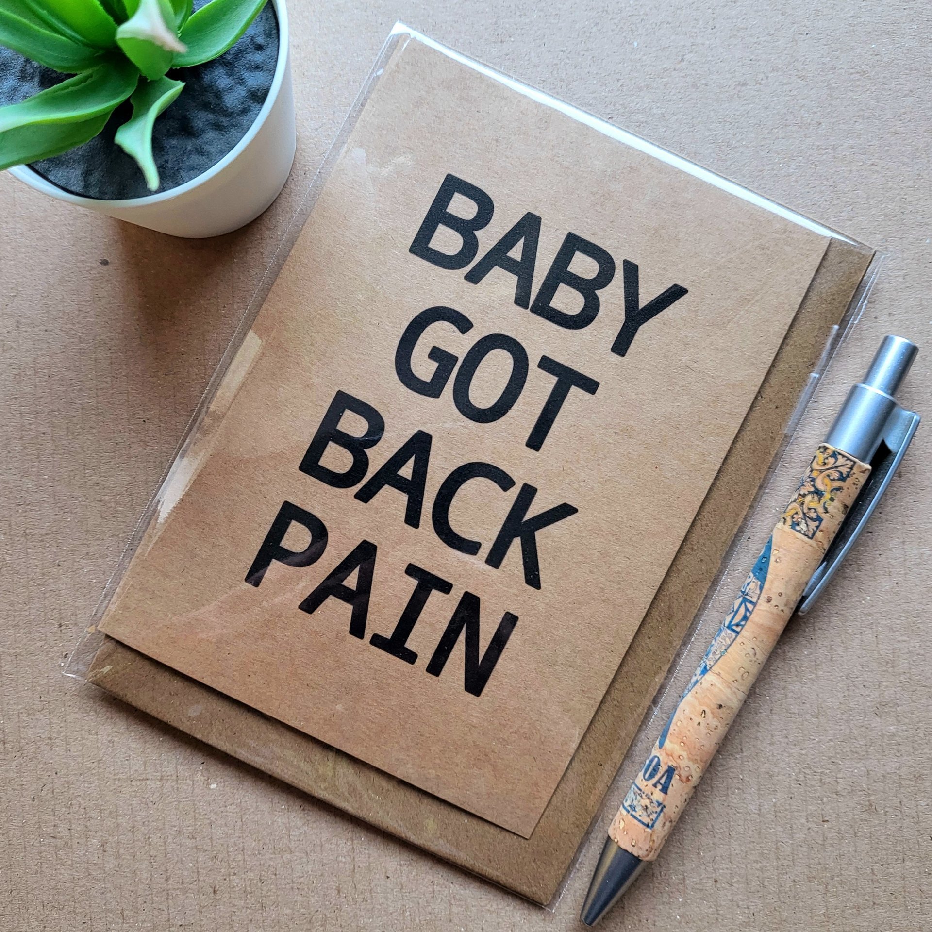 Funny Birthday card, text reads 'Baby got back pain'.