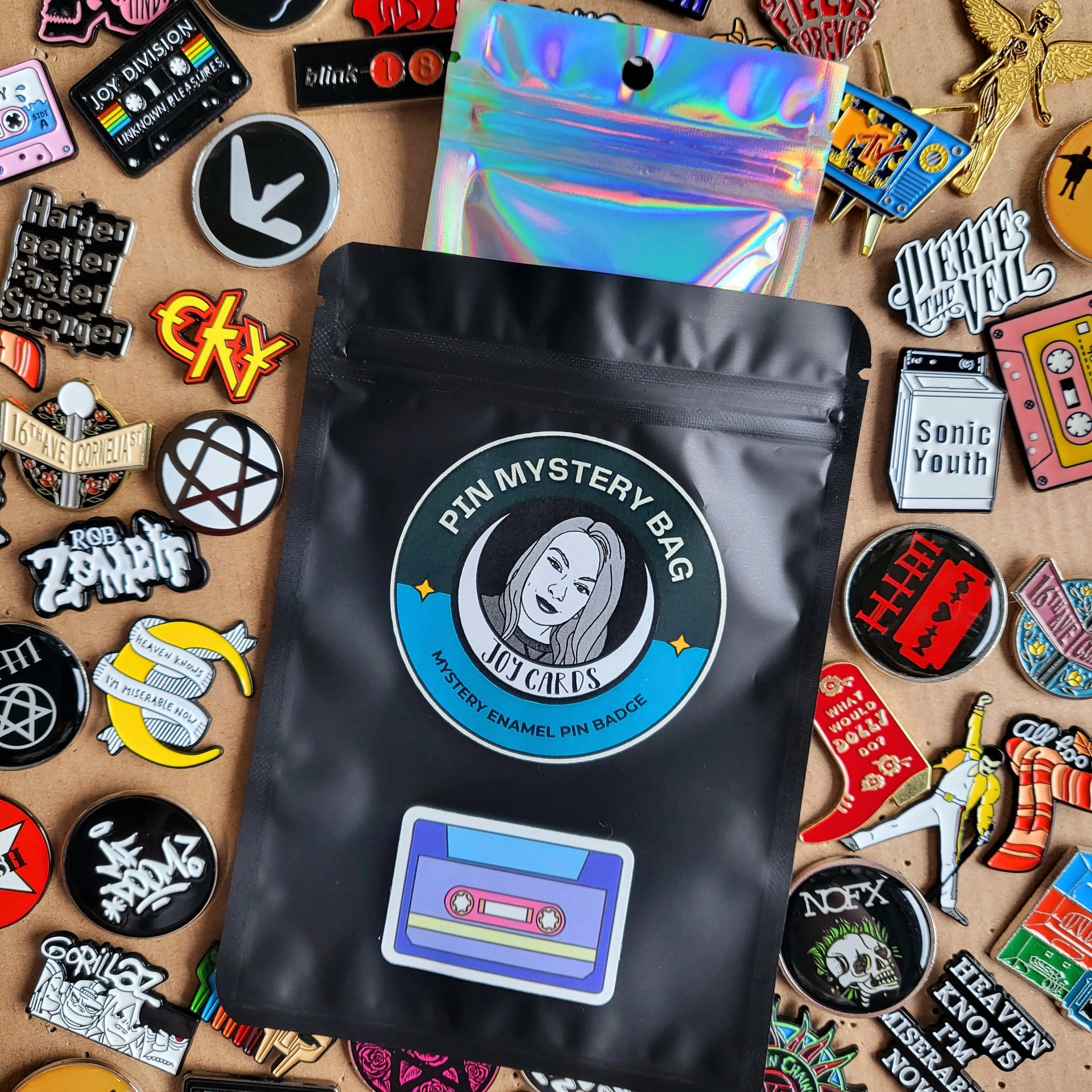 Music band enamel pin badge mystery bag featuring 1 music themed enamel pin badge, blind bag gift