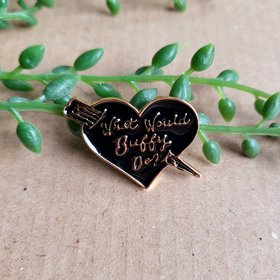 Buffy enamel pin badge, text reads "what would buffy do?" In a black heart with a stake.